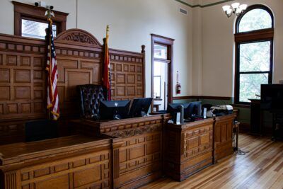 Empty wood-paneled courtroom