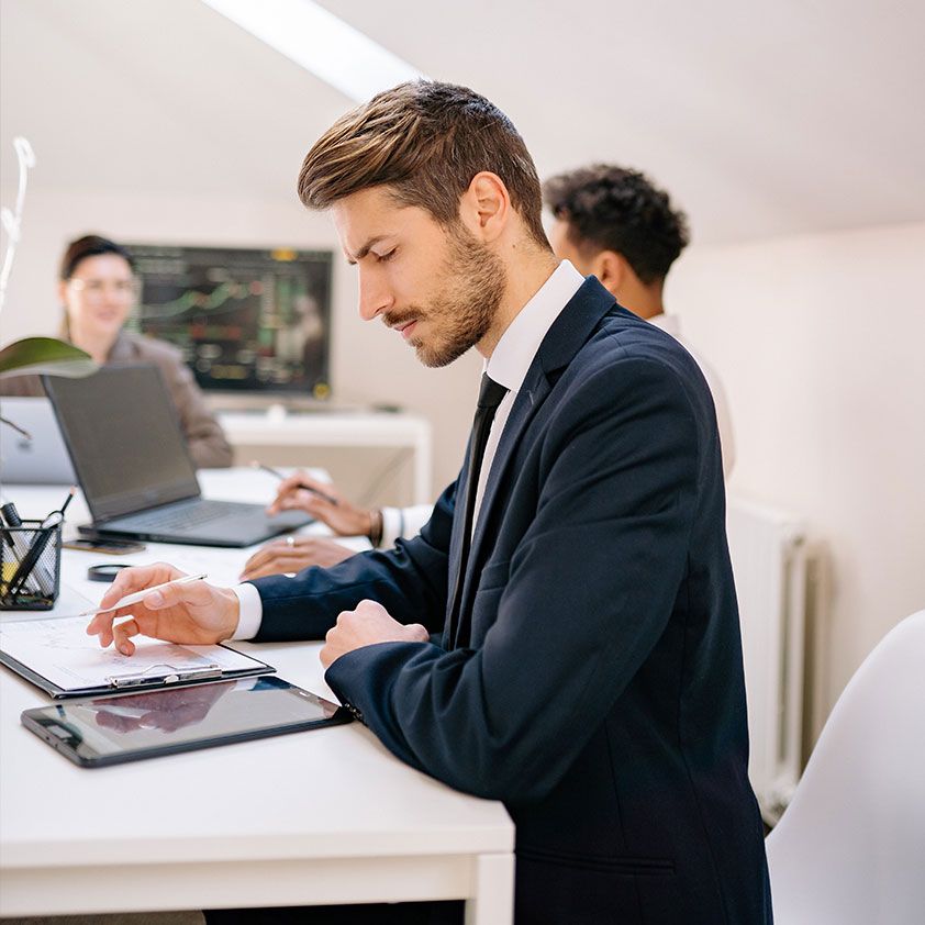 Entrepreneur working at a desk with a laptop