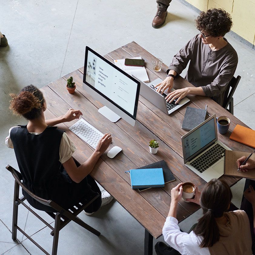 Team working together at a shared desk