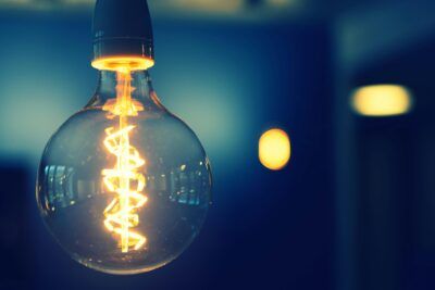 Glowing light bulb representing an invention
