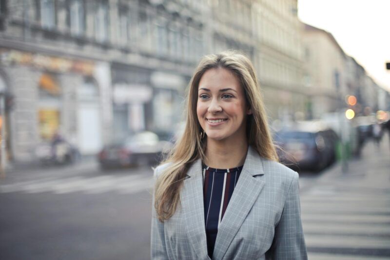 Business professional standing on a city street